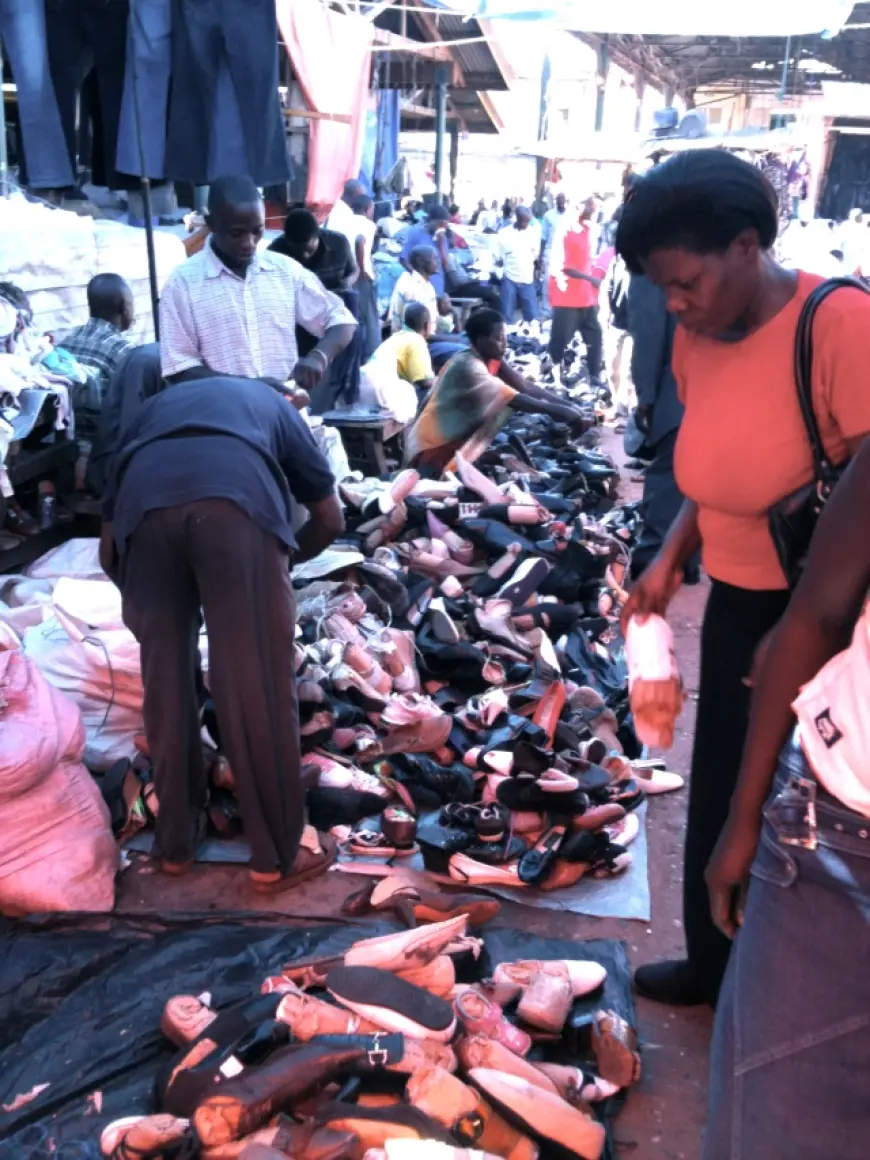 Buying shoes in Owino market
